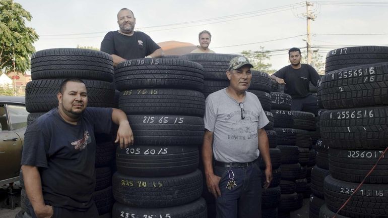 Darwin Morillo, right, from El Salvador, owner of New Car...