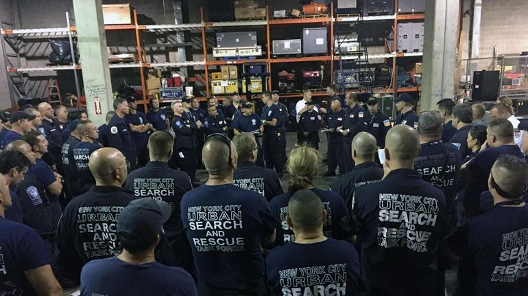 Members of New York Task Force One prepare to deploy...