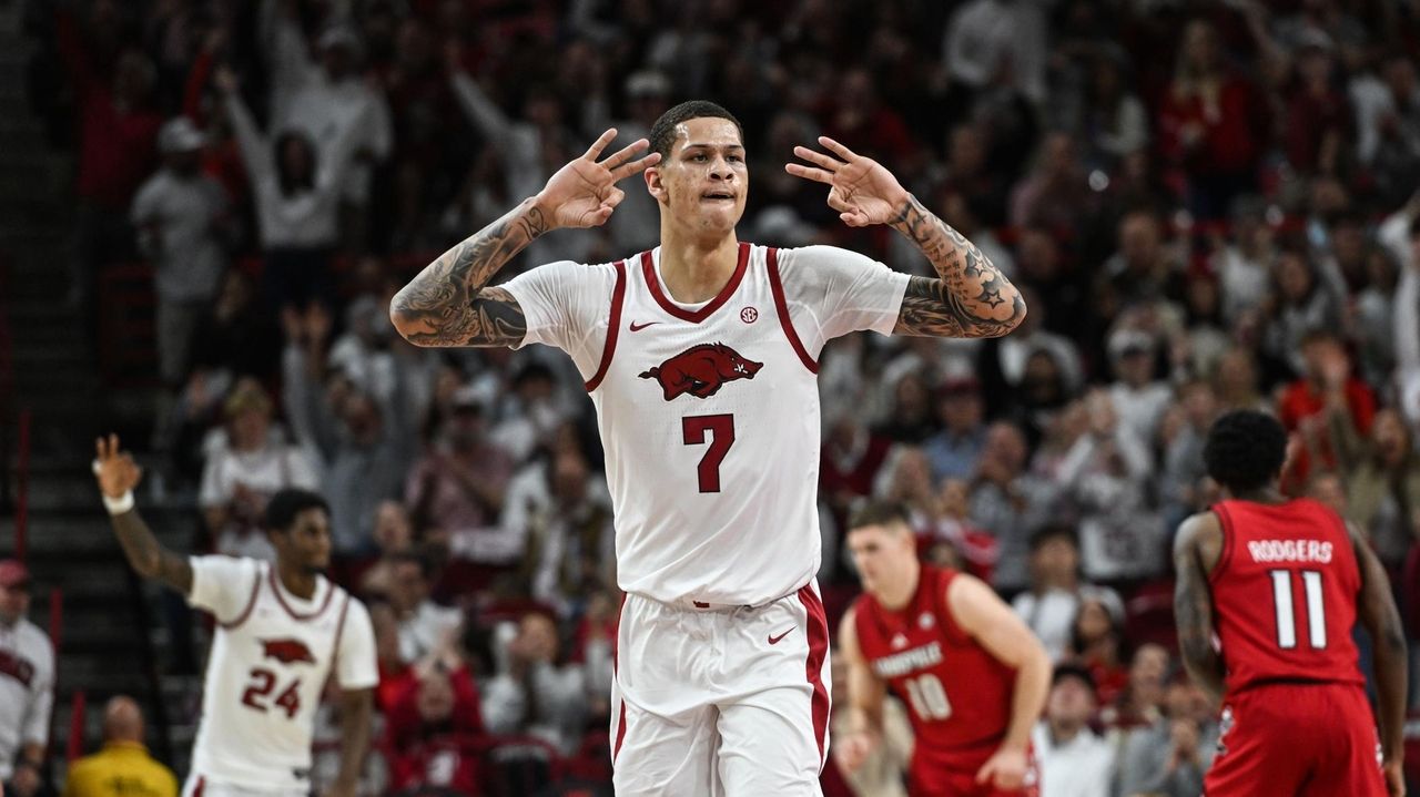 Brazile scores 21 points as No. 25 Arkansas hands No. 6 Louisville its 1st loss, 89-80