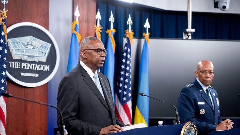 Defense Secretary Lloyd Austin, left, and Chairman of the Joint...