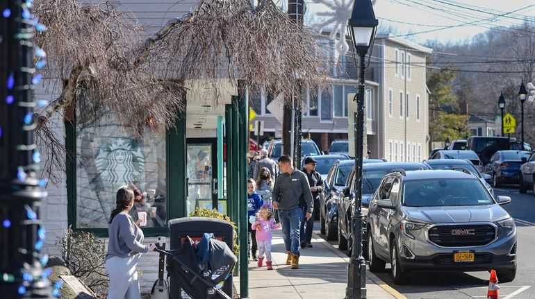 Long Islanders venturing out, like folks in Port Jefferson last...