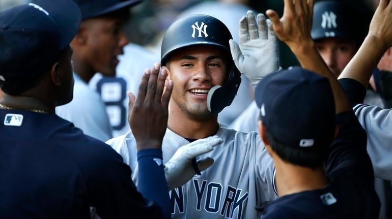 Gleyber Torres of the Yankees celebrates his two-run home run...