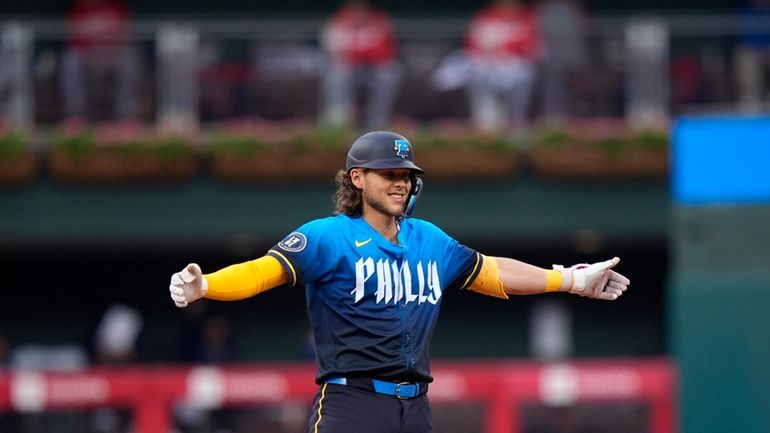 Philadelphia Phillies' Alec Bohm reacts after hitting a run-scoring against...