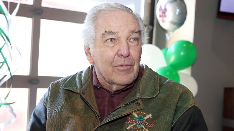 Mets legend Ed Kranepool signs photos during the Mets' spring...