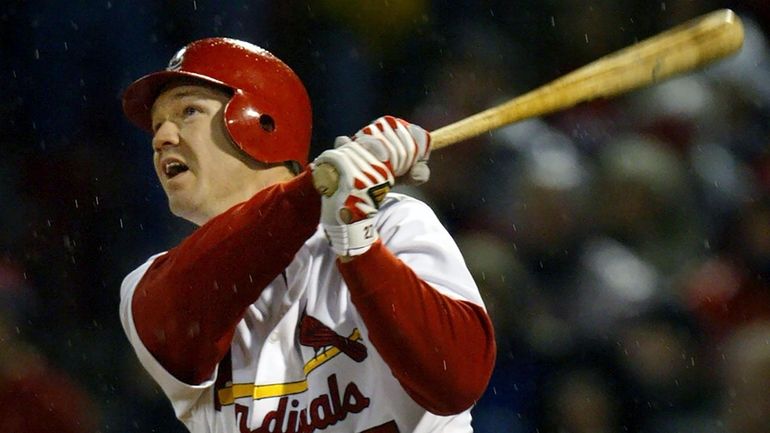 The Cardinals' Scott Rolen watches his two-run home run off Astros...