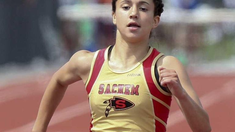 Melanie Notarstefano of Sachem East High School crosses the finish...