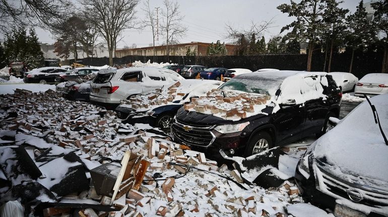 The brick facade fell from an apartment building and landed...