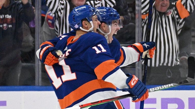 Islanders left wing Zach Parise celebrates his overtime goal against...