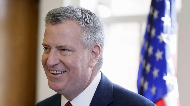 New York City Mayor Bill de Blasio speaks about income...