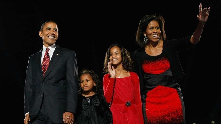 U.S. President elect Barack Obama acknowledges his supports along with...