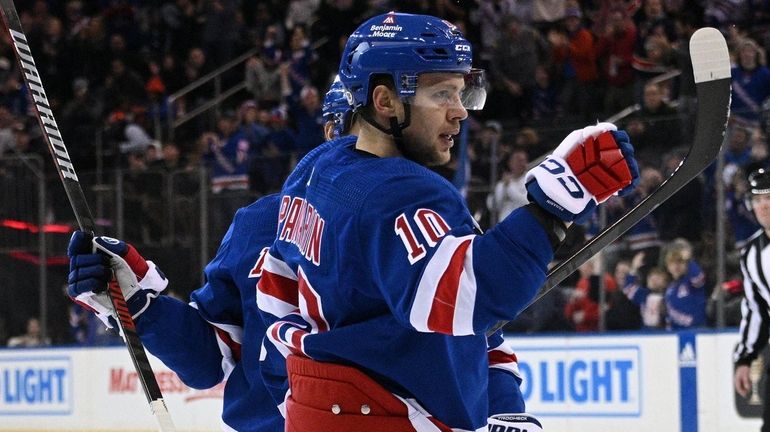 Rangers left wing Artemi Panarin reacts after scoring a power-play...