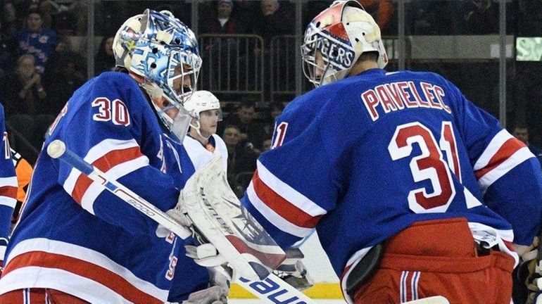 Rangers goaltender Henrik Lundqvist skates in to replace Ondrej Pavelec...