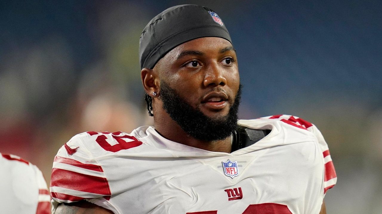 New York Giants linebacker Tomon Fox (49) walks off the field