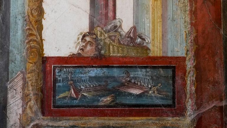 A detail of a fresco showing a sea battle framed...