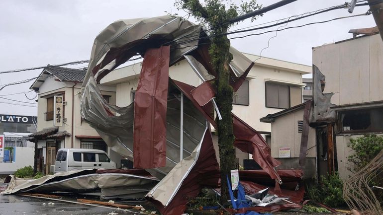 A metal object blown away by strong winds of a...