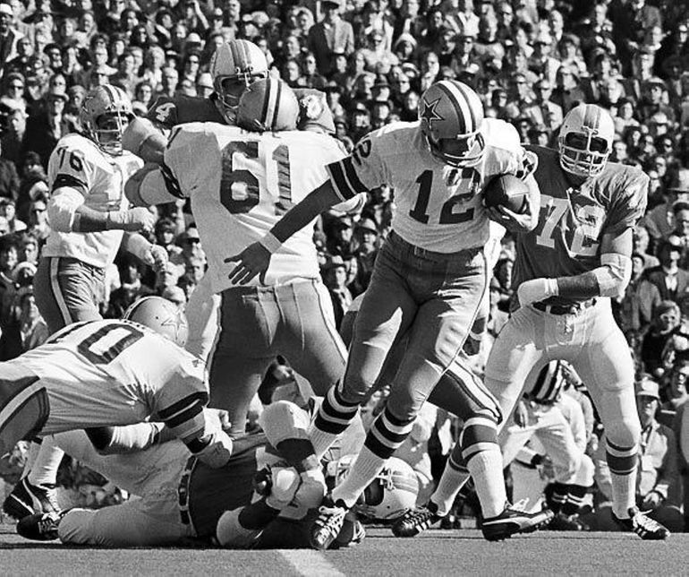 Kansas City Chiefs' running back Marcus Allen crosses the goal line for a  third quarter touchdown as Los Angeles Raiders' Eddie Anderson tries to  stop him in Los Angeles, Nov. 14, 1993.