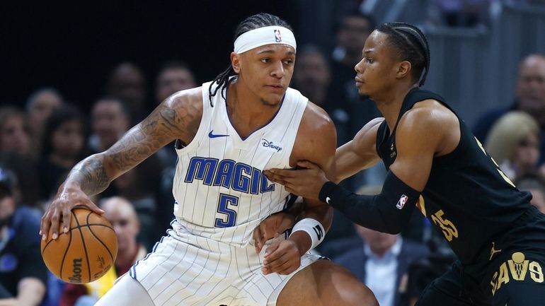 Orlando Magic forward Paolo Banchero (5) plays against Cleveland Cavaliers...