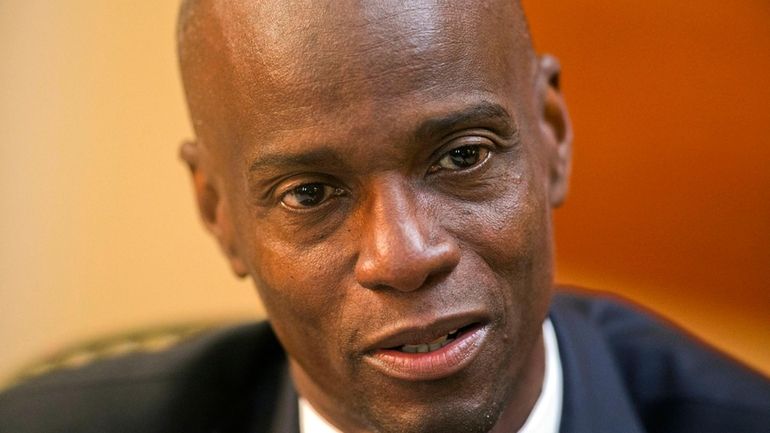 Haiti's President Jovenel Moise speaks during an interview at his...