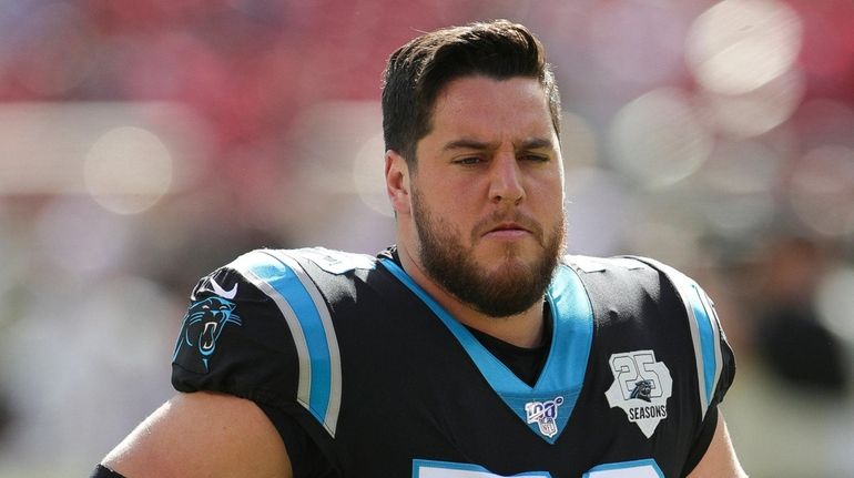  Panthers offensive guard Greg Van Roten warms up prior to an...