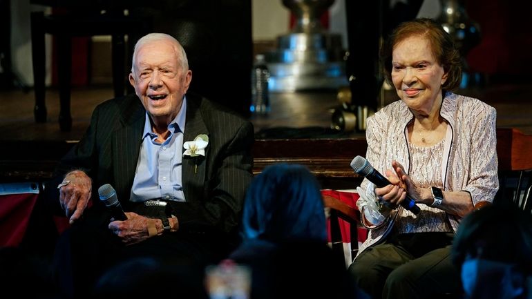 Former President Jimmy Carter and his wife former first lady...