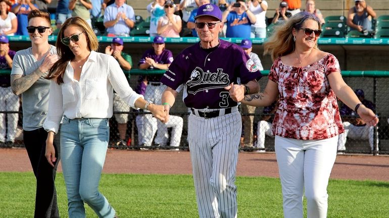 Long Island Duck's Bud Harrelson walks onto the field with...