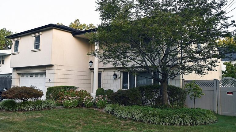 The house on Redwood Drive in Cedarhurst where three men...