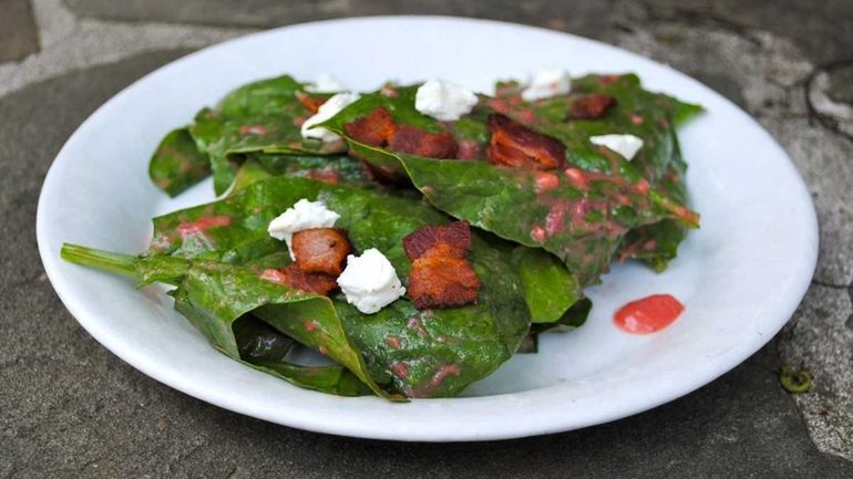 Spinach coated with a warm strawberry-rhubarb dressing will wilt slightly...