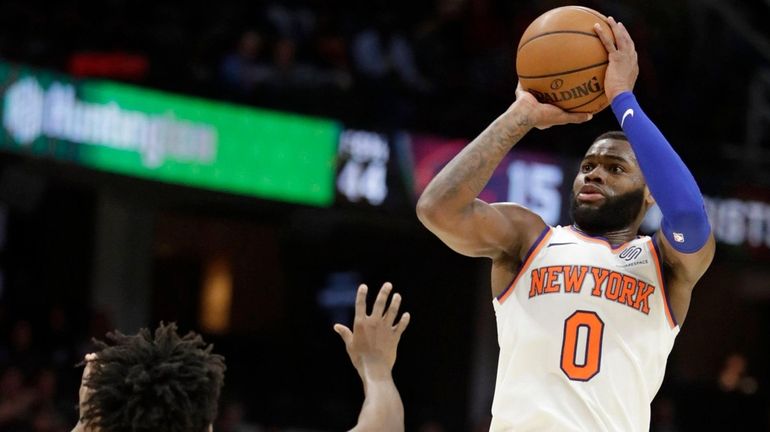 The Knicks' Kadeem Allen shoots over Cleveland's Collin Sexton on...