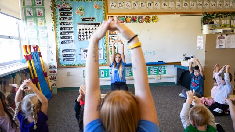 Teacher Abi Hawker leads preschoolers in learning activities at Hillcrest...