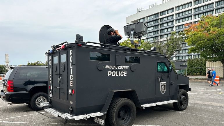 Nassau County Police scan buildings surrounding Nassau Coliseum before the...