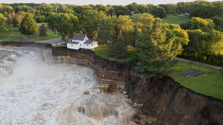 This drone photo provided by AW Aerial shows a home...