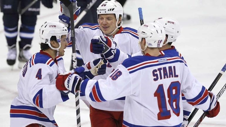 Michael Del Zotto (4), forward Ruslan Fedotenko (26), Marc Staal...