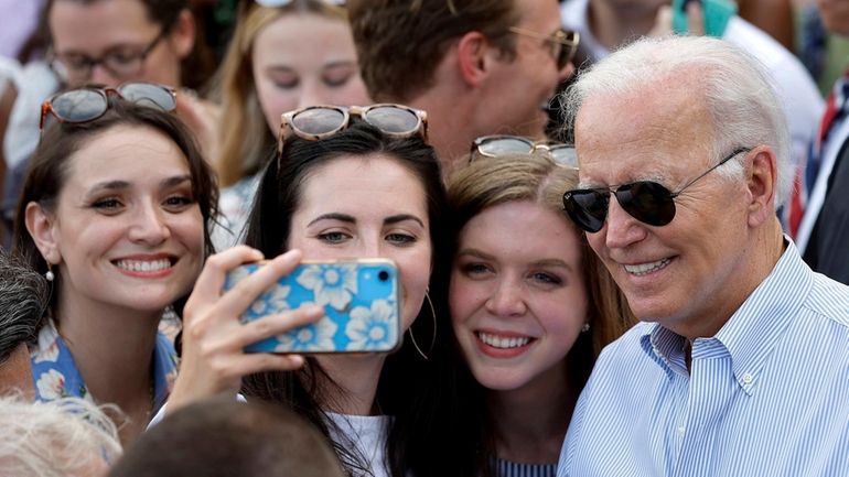 President Joe Biden poses for selfies during the Congressional Picnic...