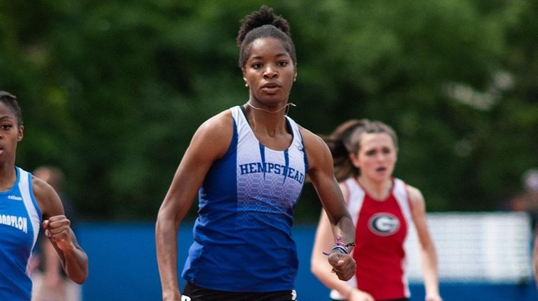 Hempstead's Anissa Moore competes in the girls division 1 400...