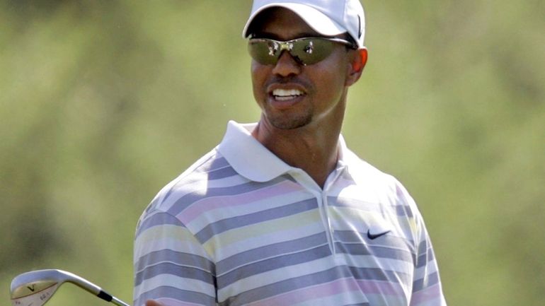 Tiger Woods plays a practice round at the Masters in...