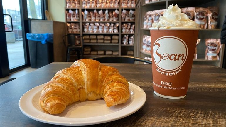 A croissant and coffee at Sayville Bean Coffeehouse, new to...