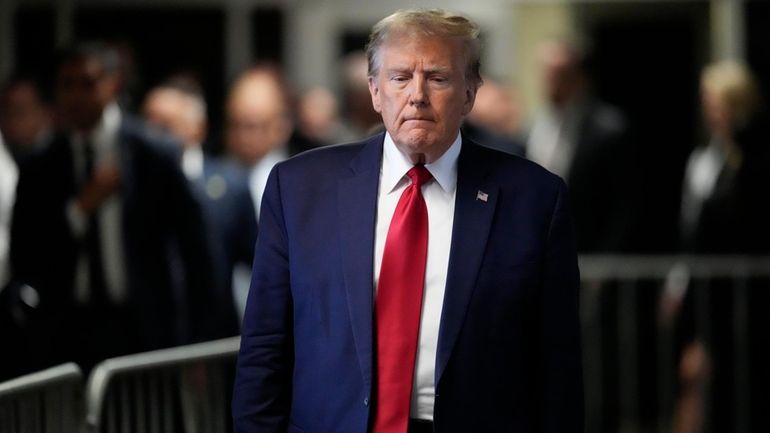 Former President Donald Trump leaves Manhattan criminal court, Thursday, Feb....