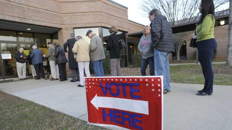 Voters line up to cast their ballots iat Medlock Bridge...