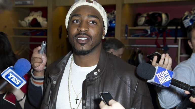 Giants wide receiver Hakeem Nicks talks to the media after...