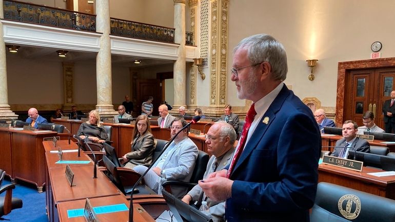 Kentucky state Sen. Johnnie Turner, front, gives a speech on...