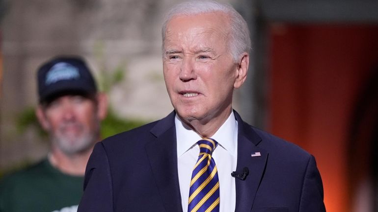 President Joe Biden's speaks with football players at Archmere Academy...