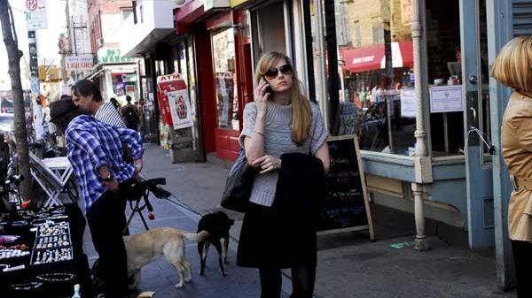 Shoppers walk along Bedford Avenue in Williamsburg. (Newsday / Rebecca...