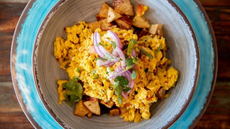 The curry bowl of potatoes and scrambled eggs at Cafe...