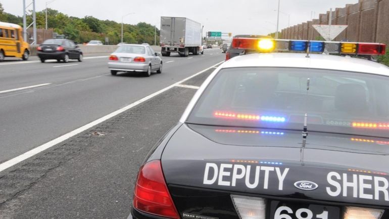 Suffolk County police check on a motorist along eastbound LIE....