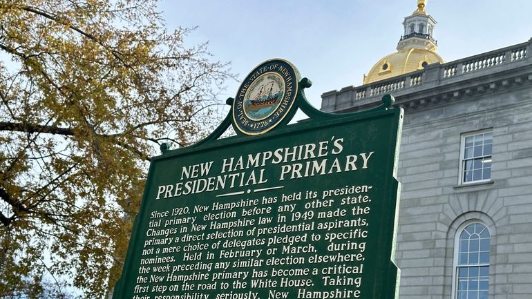 A historical marker displayed outside the Statehouse in Concord, New...