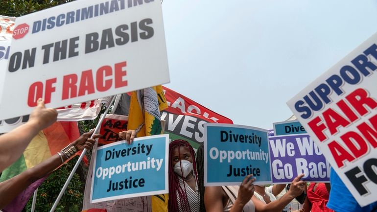 People protest outside of the Supreme Court in Washington, Thursday,...