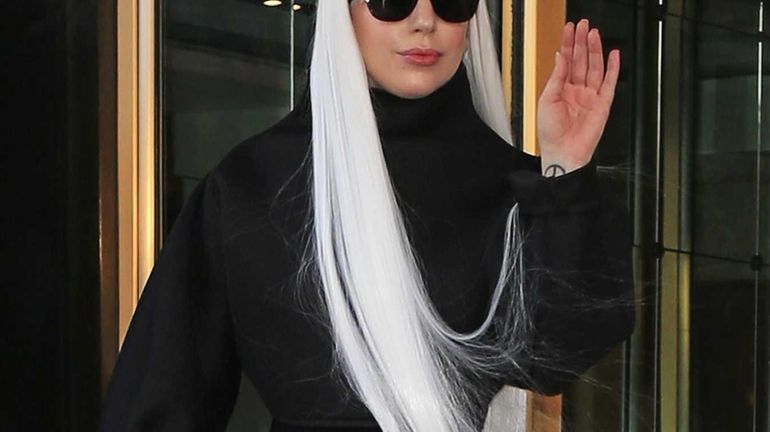 Lady Gaga wears her hair long while on the way...