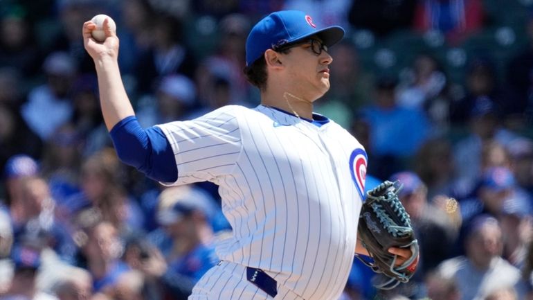 Chicago Cubs starting pitcher Javier Assad throws against the Milwaukee...