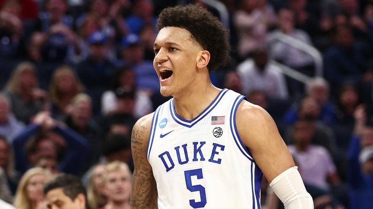 Paolo Banchero #5 of the Duke Blue Devils celebrates after...