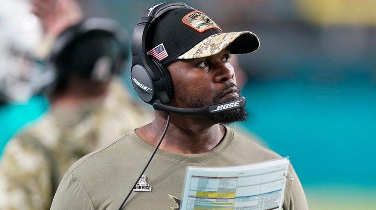 Dolphins head coach Brian Flores watches the game from the...